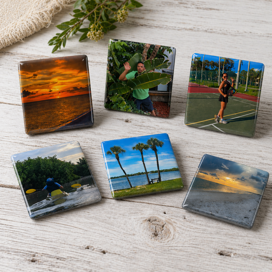 Set of six square photo coasters on a wooden surface